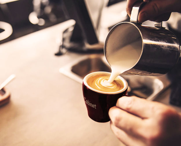 Barista pouring latte art